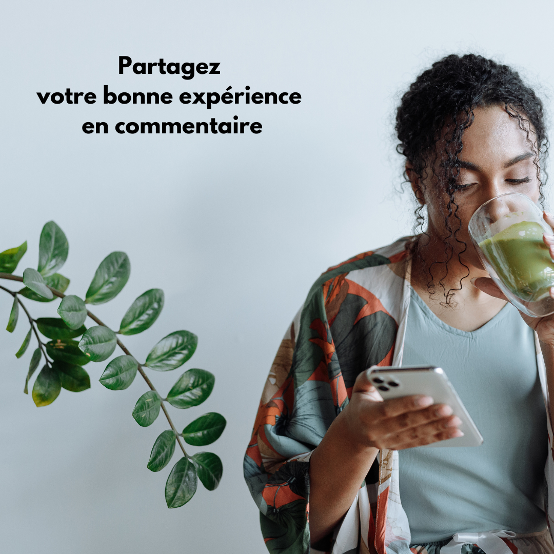 Woman drinking green smoothie and holding smartphone beside indoor plant with text inviting to share positive experience comment